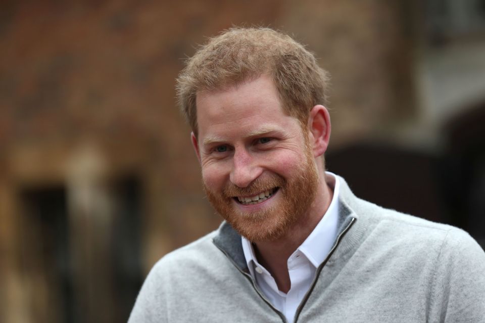  Prince Harry beams following the birth of his son this morning