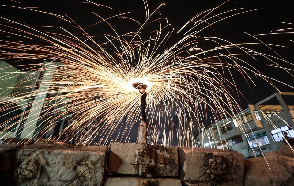  Gazaian youth perform fire spinning during the holy month of Ramadan in Gaza City, Gaza on May 6