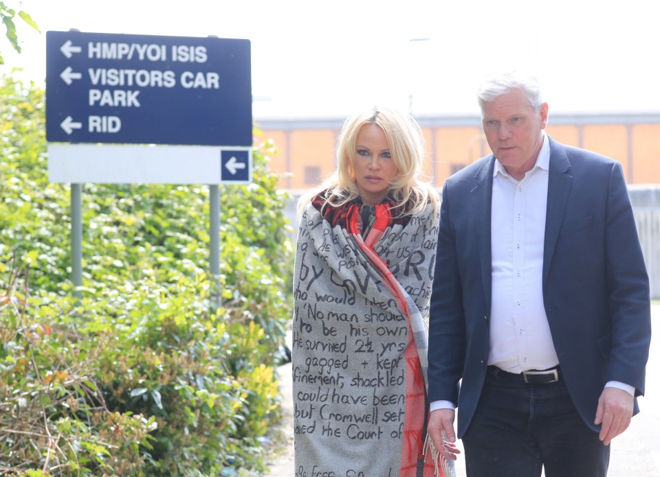 US actress Pamela Anderson leaves Belmarsh Prison in south-east London, accompanied by WikiLeaks editor Kristinn Hrafnsson