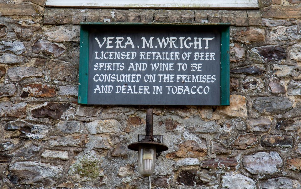  A sign outside shows the pub is licensed to sell booze