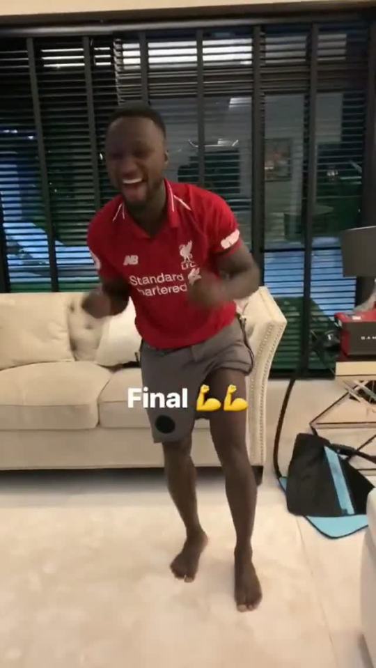  Keita supported his teammates in his Liverpool shirt in his living room