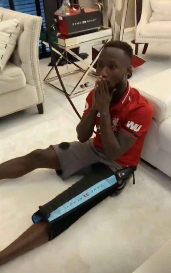  Naby Keita looks tense watching Liverpool's clash with Barcelona