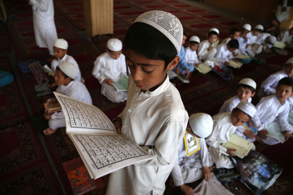  Afghan children learn to read the holy Koran at a mosque during the holy Fasting month of Ramadan, in Jalalabad, Afghanistan. Muslims around the world are celebrating the holy month of Ramadan by praying during the night time and abstaining from eating, drinking, and sexual acts daily between sunrise and sunset