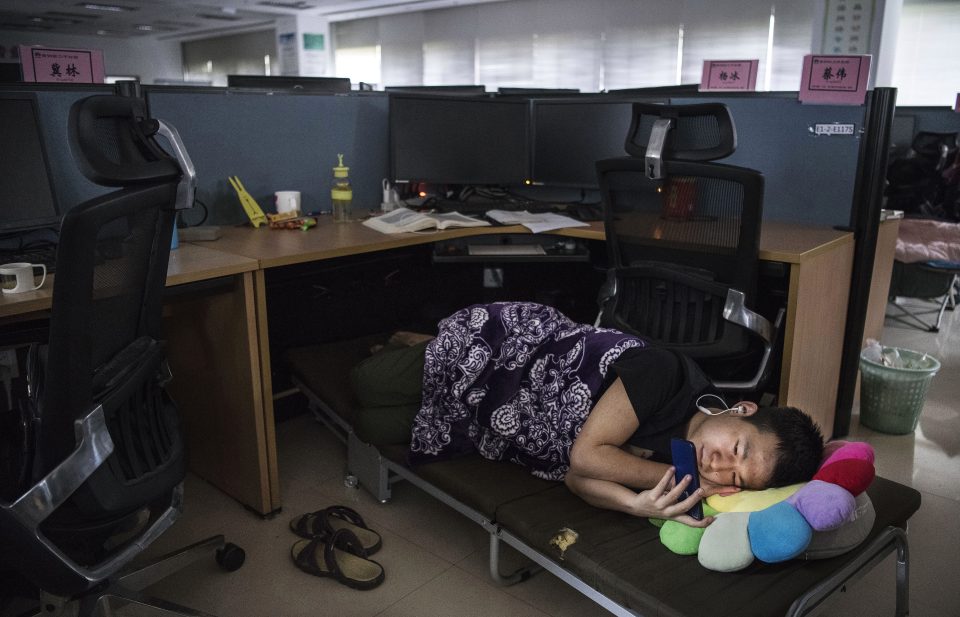  Another can be seen sleeping at his desk during a shift