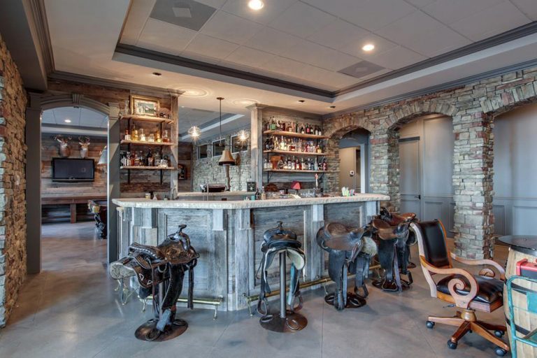  When Kelly Clarkson was trying to sell her home in 2017, we got a sneak peek inside her fun-looking bar with saddles on bar stools