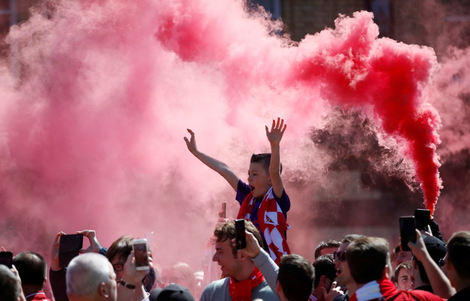  Liverpool fans let off flairs outside Anfield ahead of the game