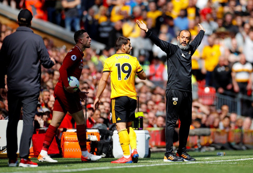  Nuno Espirito Santo waves on his Wolves side at Anfield