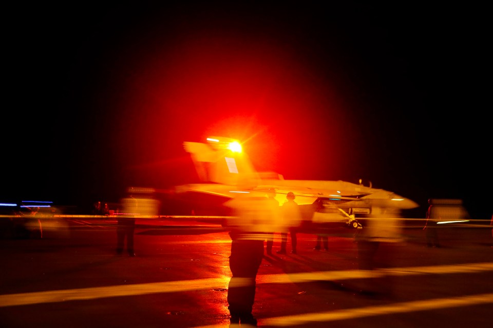  An F/A-18E Super Hornet aircraft launches from the flight deck the Nimitz-class aircraft carrier USS Abraham Lincoln in the Persian Gulf