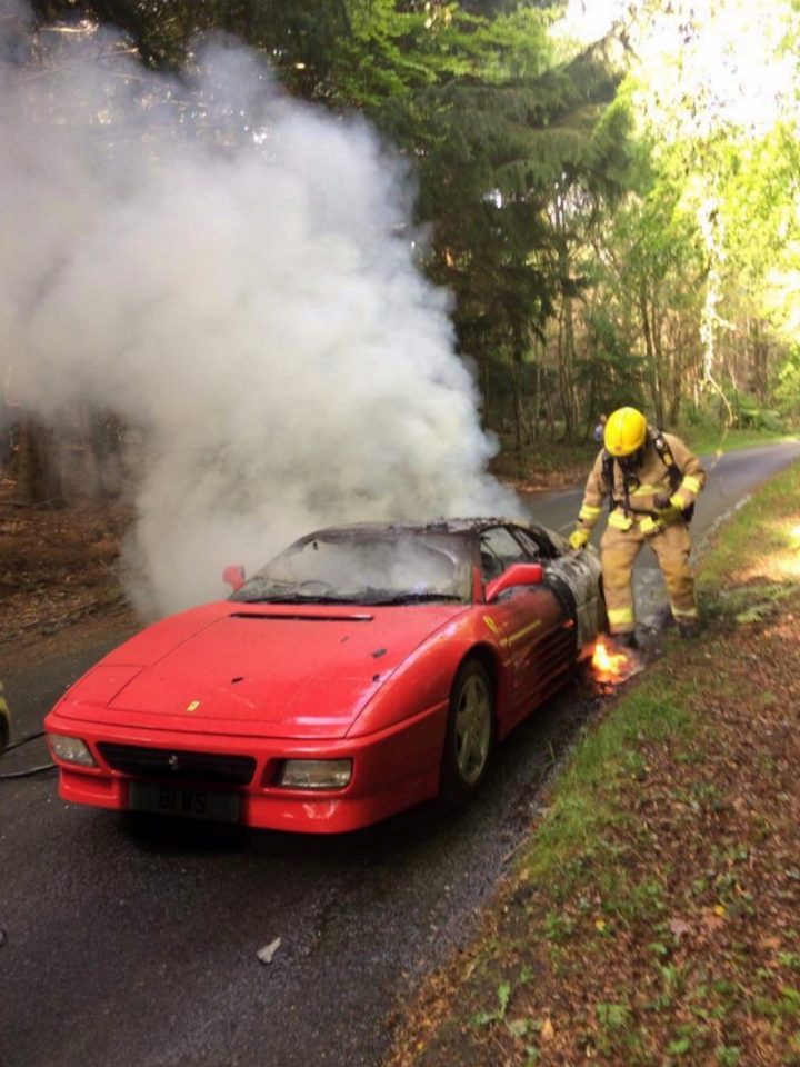  Fire crews battled to put out the flames after the driver of the car managed to escape unharmed