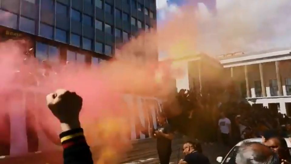  Roma fans let off smoke bombs outside the directors' offices in the city in protest