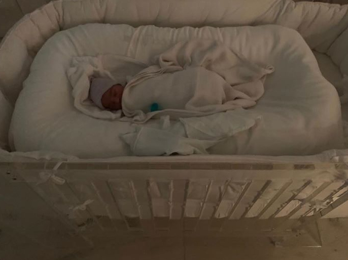  Alongside the picture of the tiny child asleep in his cot, Kim wrote: 'Psalm West' in her social media posts