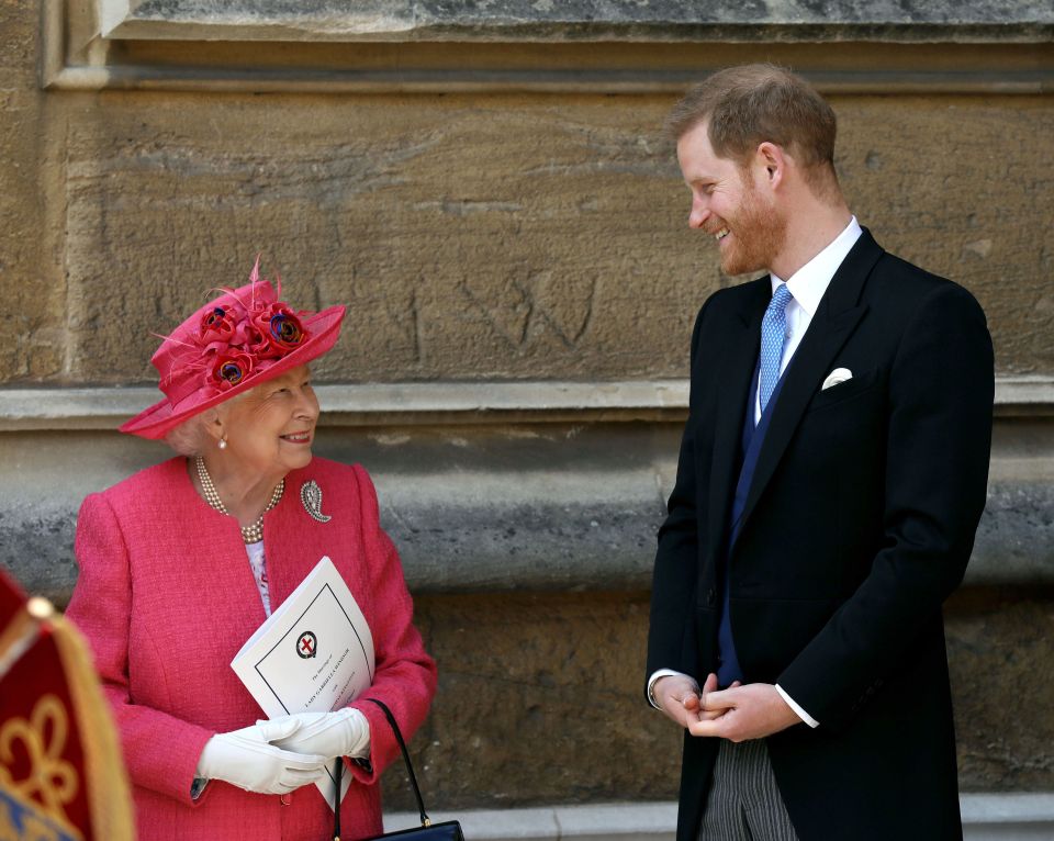 Prince Harry made a surprise appearance at the wedding, seen here speaking to the Queen