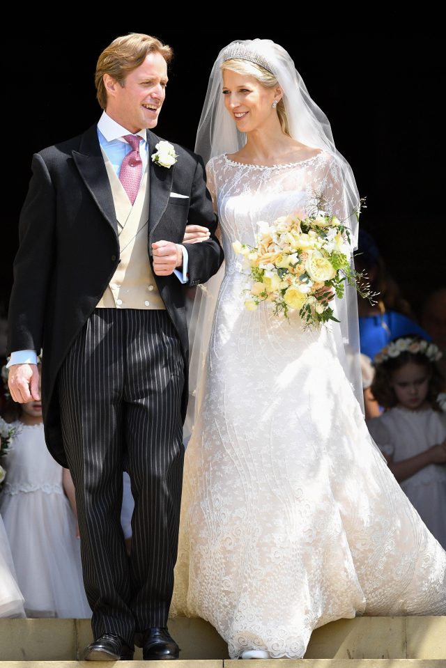 The newlyweds beam as they leave the chapel 