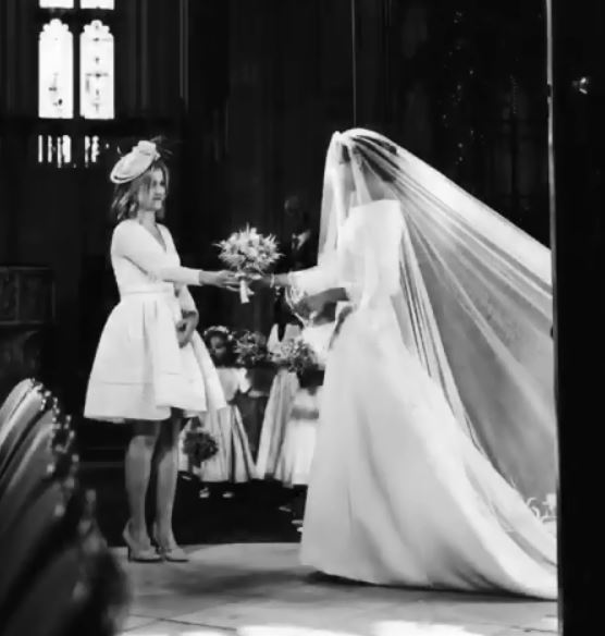  Meghan hands her bouquet to The Queen's assistant press secretary Samantha Cohen