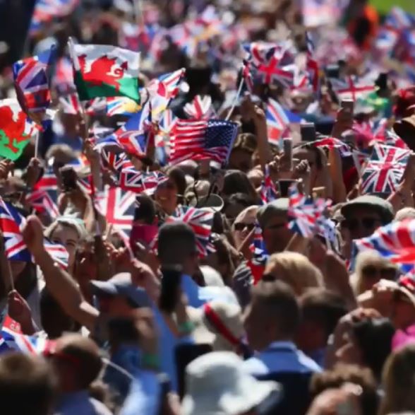  The crowds of thousands cheered on the happy couple