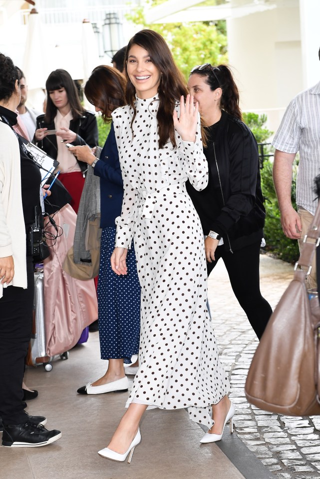  The stunning model looked demure in the ankle-length polka-dot dress