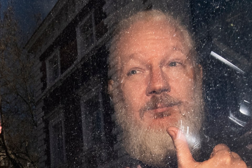  WikiLeaks founder Julian Assange is seen in a police van after was arrested by British police outside the Ecuadorian embassy in London