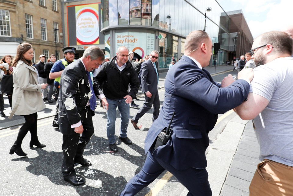  A man has been charged with assault after throwing a milkshake at Mr Farage