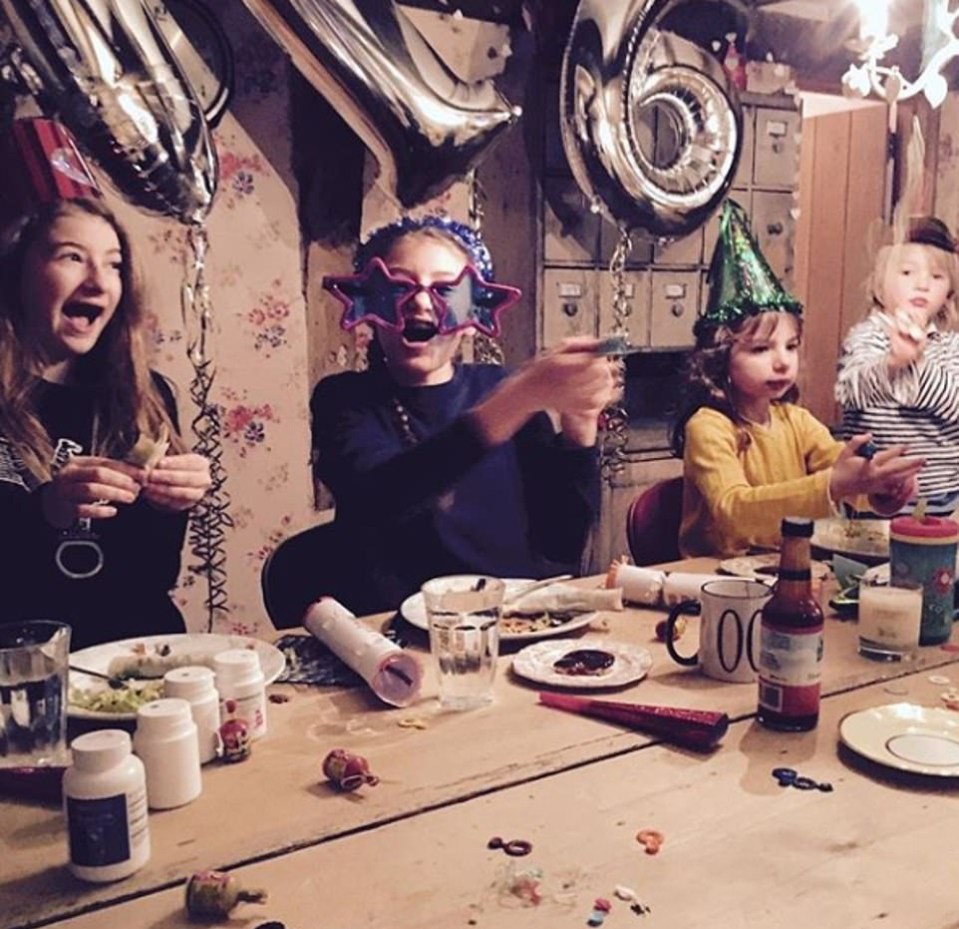  Poppy, River, Daisy, Petal and Buddy celebrating the New Year in 2016  at a large table