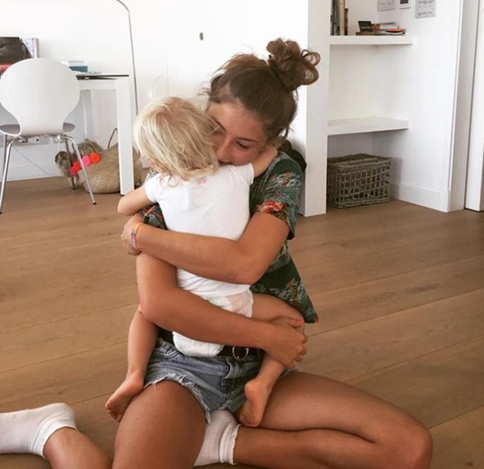  Jools shared this snap of two of the Oliver children cuddling on the wooden flooring of the house