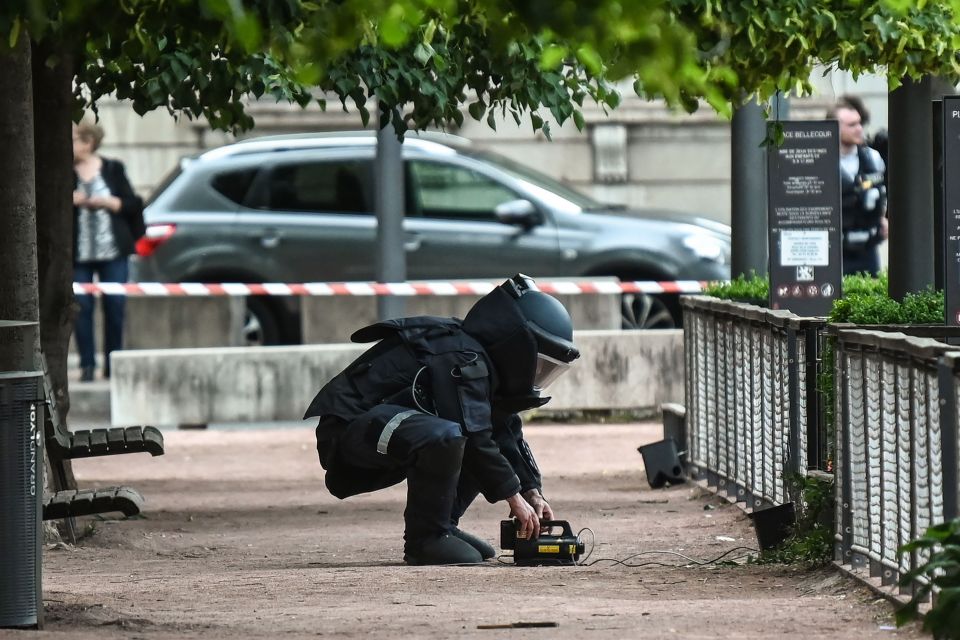  A bomb disposal expert works at the scene of the explosion