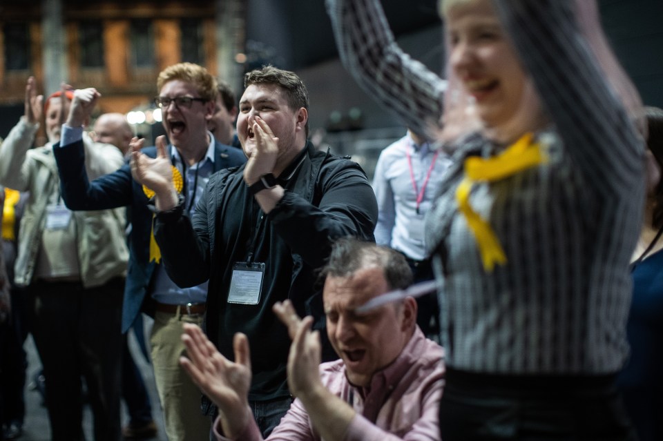  Lib Dem activists celebrating their party's success