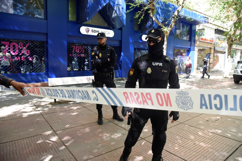 Police block off Huesca’s headquarters during a raid over alleged match-fixing