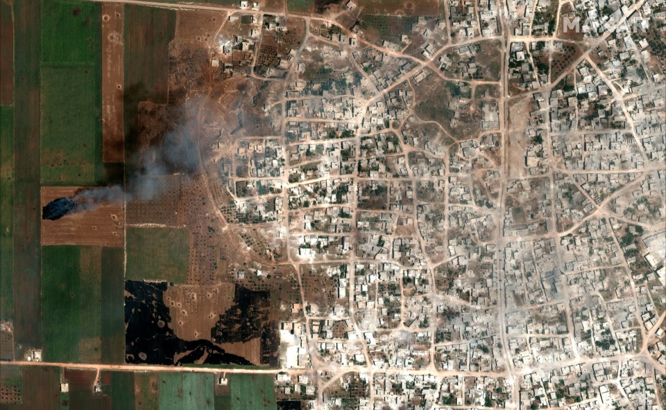  A satellite overview image showing smoke rising from the same area, taken May 26