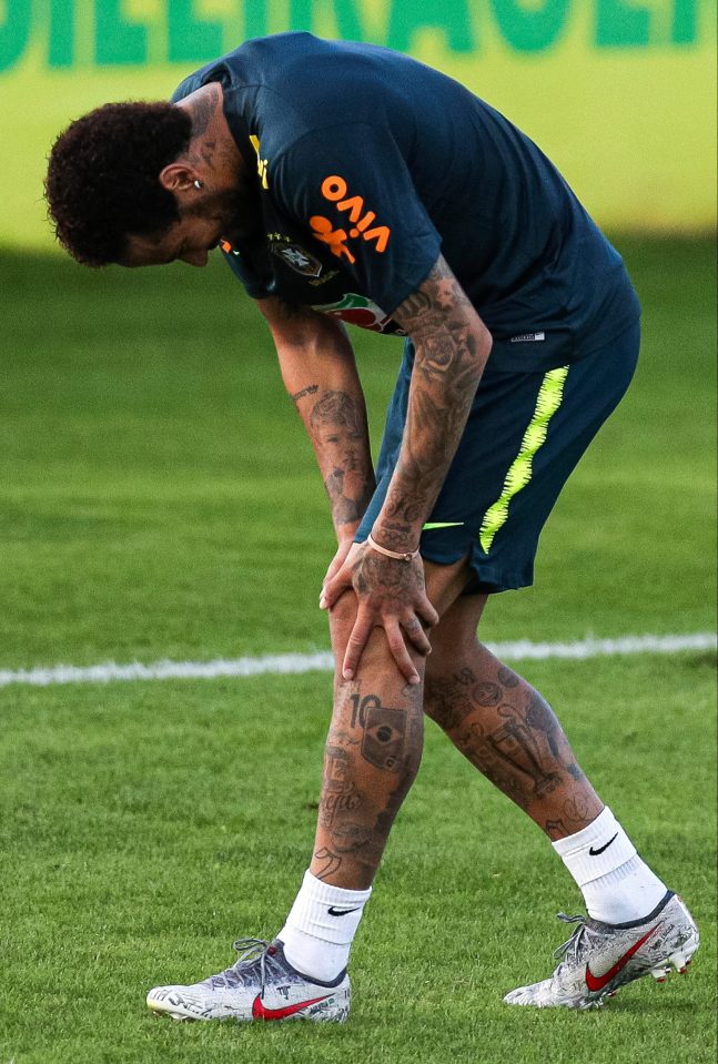  Neymar clutches his knee in training after taking a shot amid fears injuries could hamper his Copa America preparations