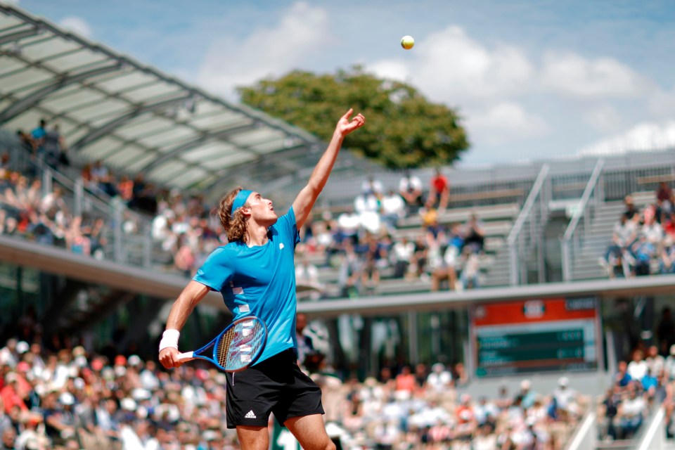 Stefanos Tsitsipas watches the ball as he serves to Bolivia’s Hugo Dellien