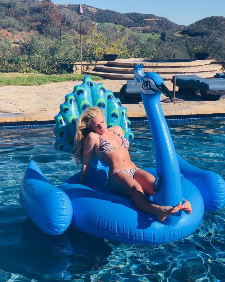  Britney puts her recent troubles behind her as she relaxes on float