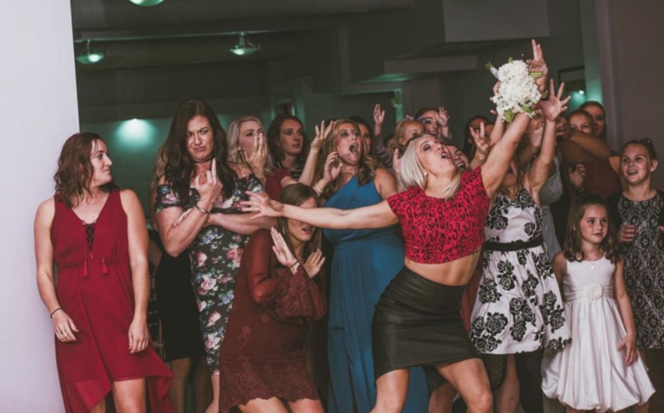  One woman was determined to be the one to walk away with the bouquet... and not everyone was impressed