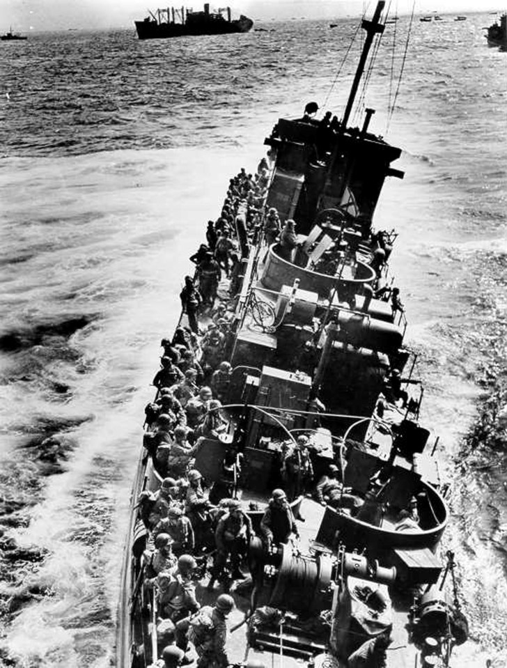  The Coast Guard LCI(L)-85, battered by enemy fire after approaching Omaha Beach, prepares to evacuate the troops to the U.S.S. Samuel Chase, June 1944