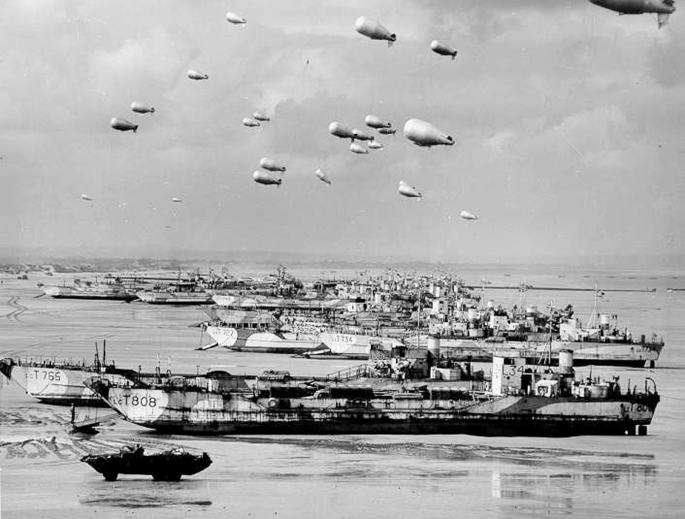  British LCT's line the Normandy shore, each with a barrage balloon designed to discourage enemy air attack, sometime before the D-Day invasion