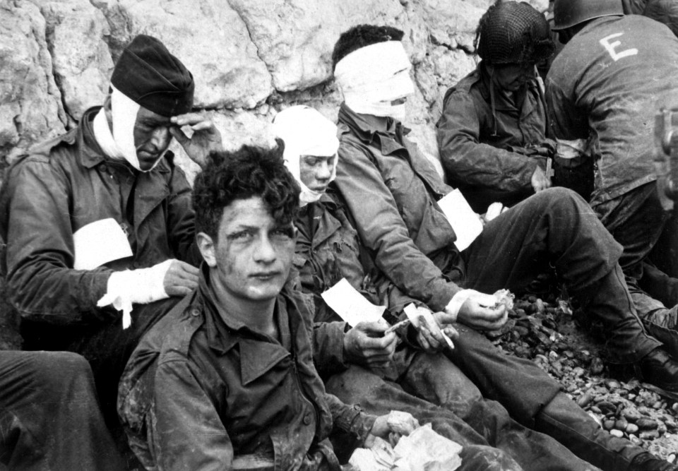  American assault troops of the 16th Infantry Regiment, injured while storming Omaha Beach