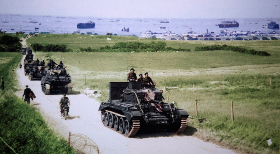  A Cromwell tank leads a British Army column from the 4th County of London Yeomanry, 7th Armoured Division, inland from Gold Beach after landing on D-Day in Ver-sur-Mer, France, on June 6, 1944 in this handout photo provided by the National Archives of Canada