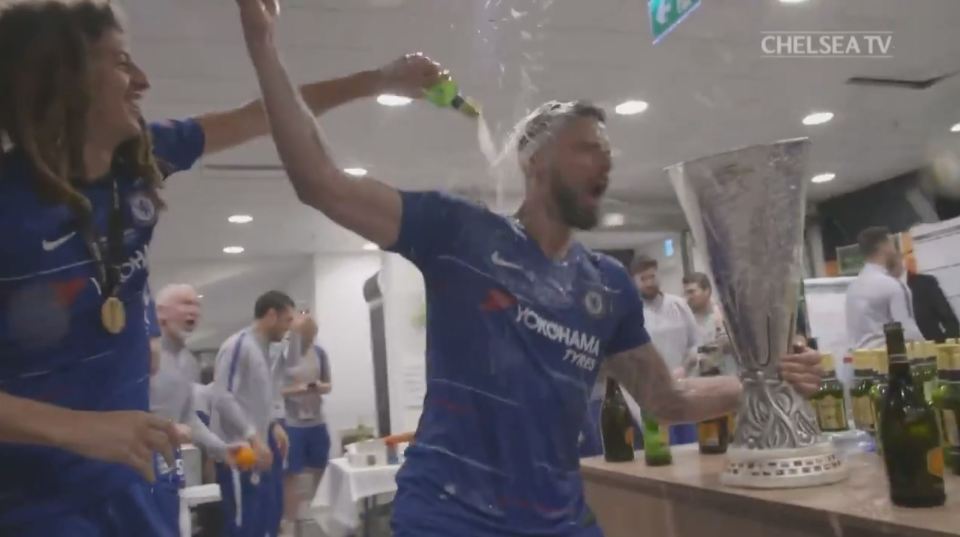  Olivier Giroud was soaked with beer as he led the celebrations inside the Chelsea dressing room