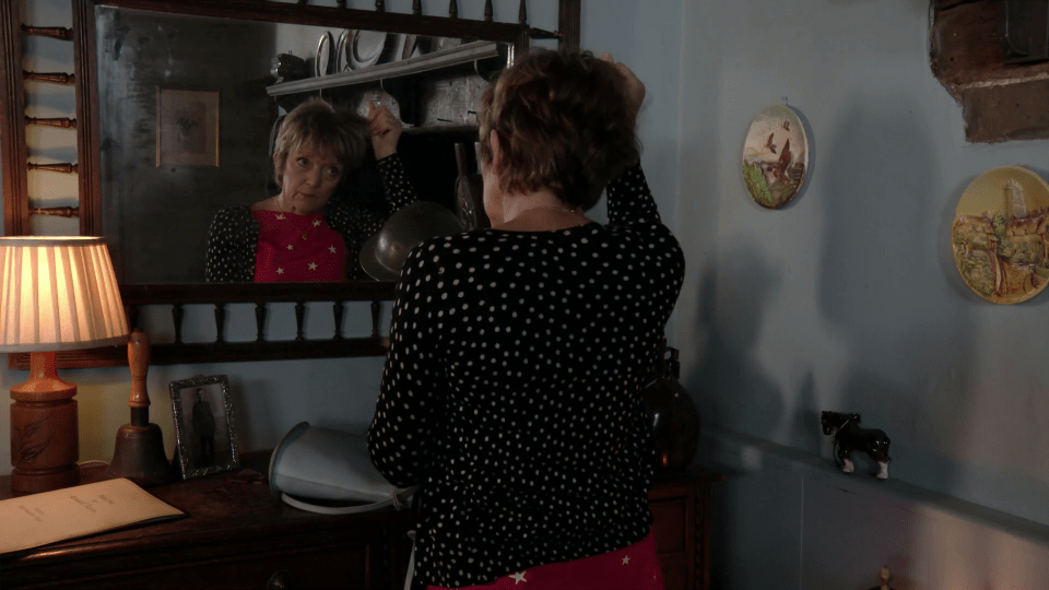  Jean pulled clumps of hair out as she stood in front of the mirror in EastEnders