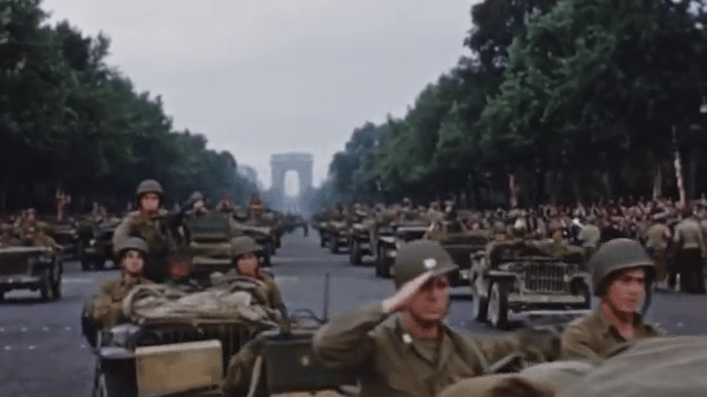  Troops ride out on tanks through the Arc de Triomphe after the liberation of Paris where the German garrison surrendered the French capital on 25 August 1944