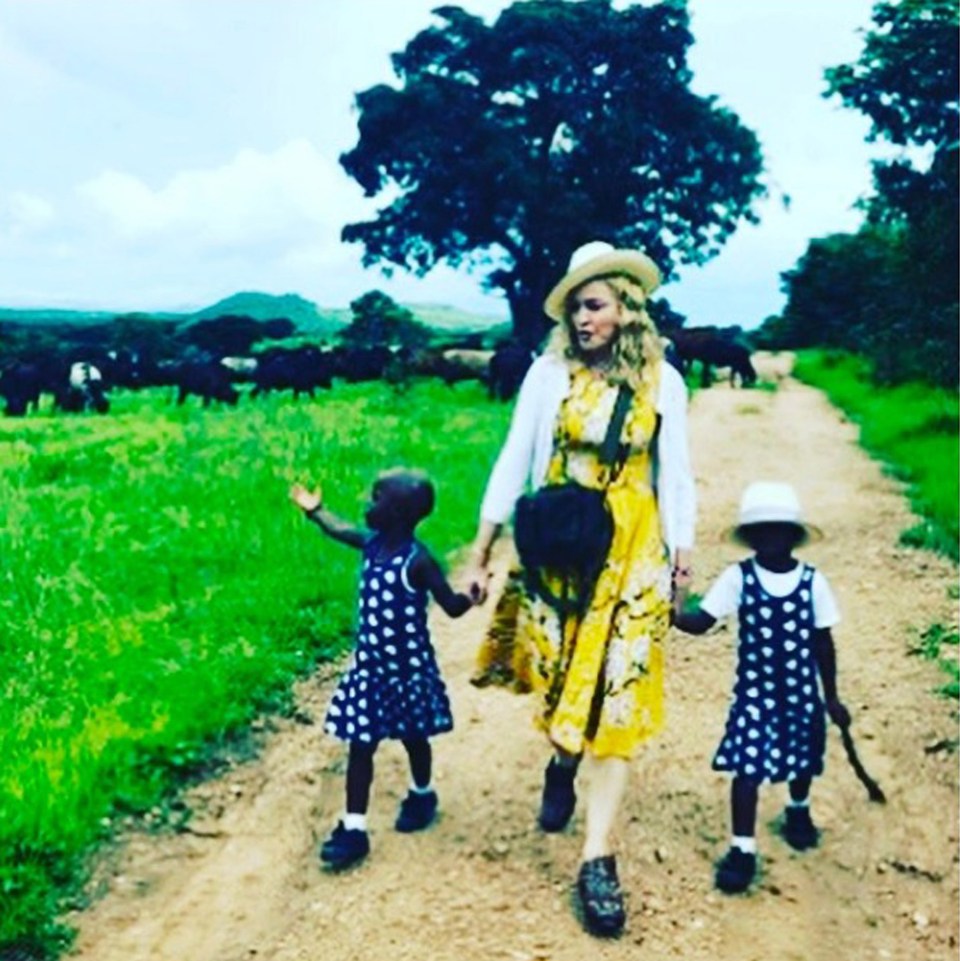 Madonna has referred to her family life as ‘unconventional’, seen here with her twin daughters Stella and Esther