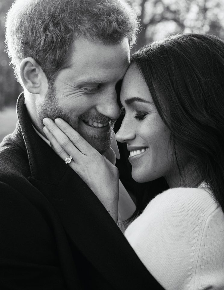  Some of the swiped photos appearing online show Harry, 34, hugging Meghan, 37, with his eyes closed as she beams for the camera