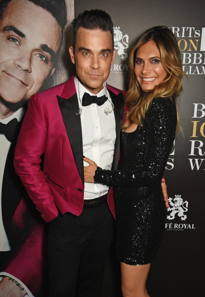  Robbie with wife Ayda Field. The star is said to have angered HMRC officials by challenging them over his tax affairs