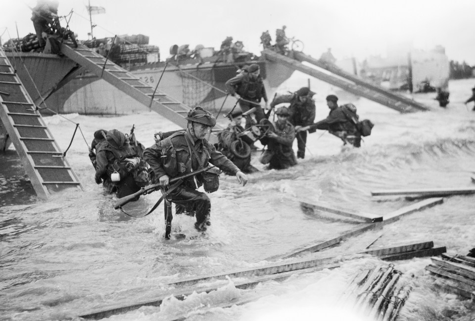  Royal Marine Commandos come ashore at Juno Beach at Saint Aubin-sur-Mer on the morning of D-Day, June 6, 1944