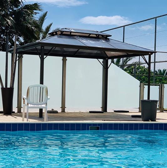 The Mysterious Girl hitmaker has a large rectangular pool with a canopy fitted on the side to help the family cool down