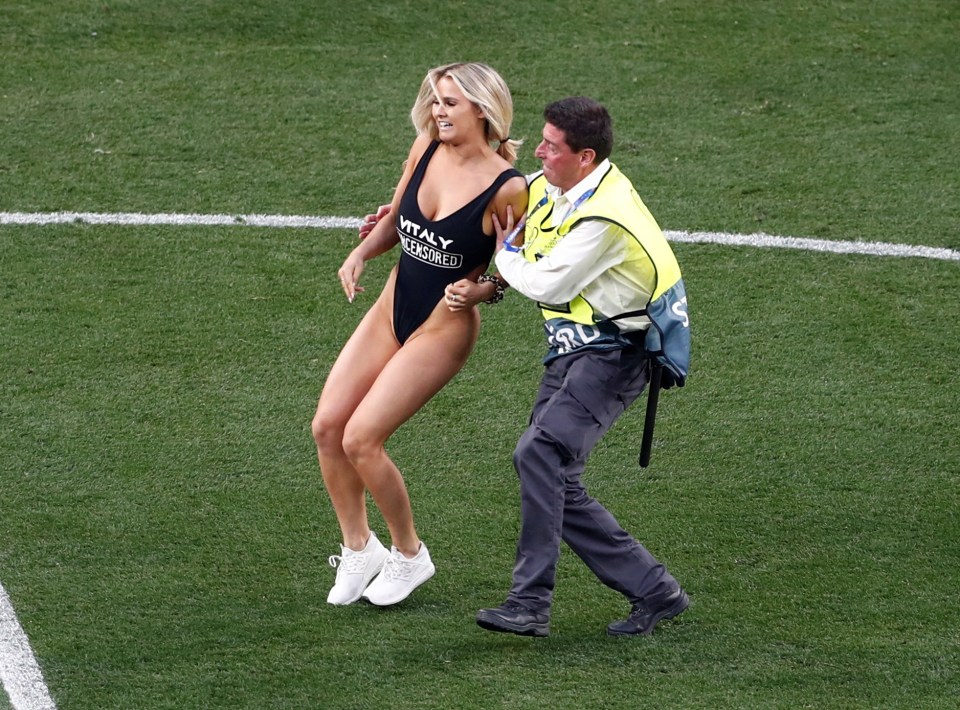  A busty blonde pitch invader ran on to the field of play in the first half as the game was paused