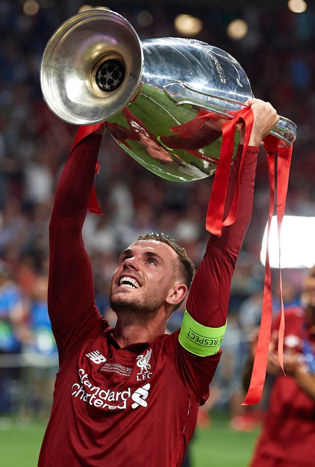  Jordan Henderson of Liverpool lifts the Champions League Trophy after winning the UEFA Champions League Final against Tottenham Hotspur