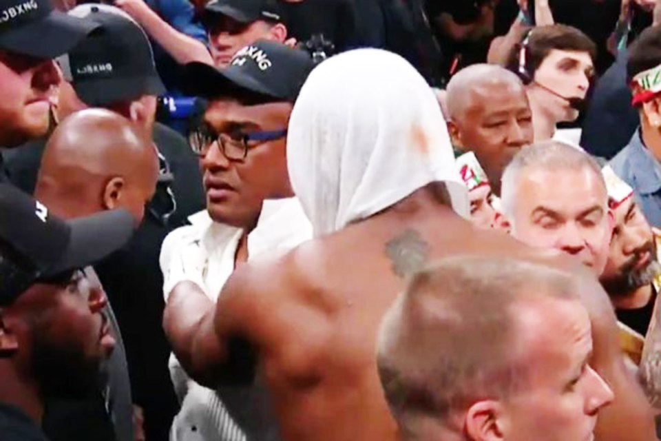  Robert, wearing the black cap, appeared to have a few words for Hearn