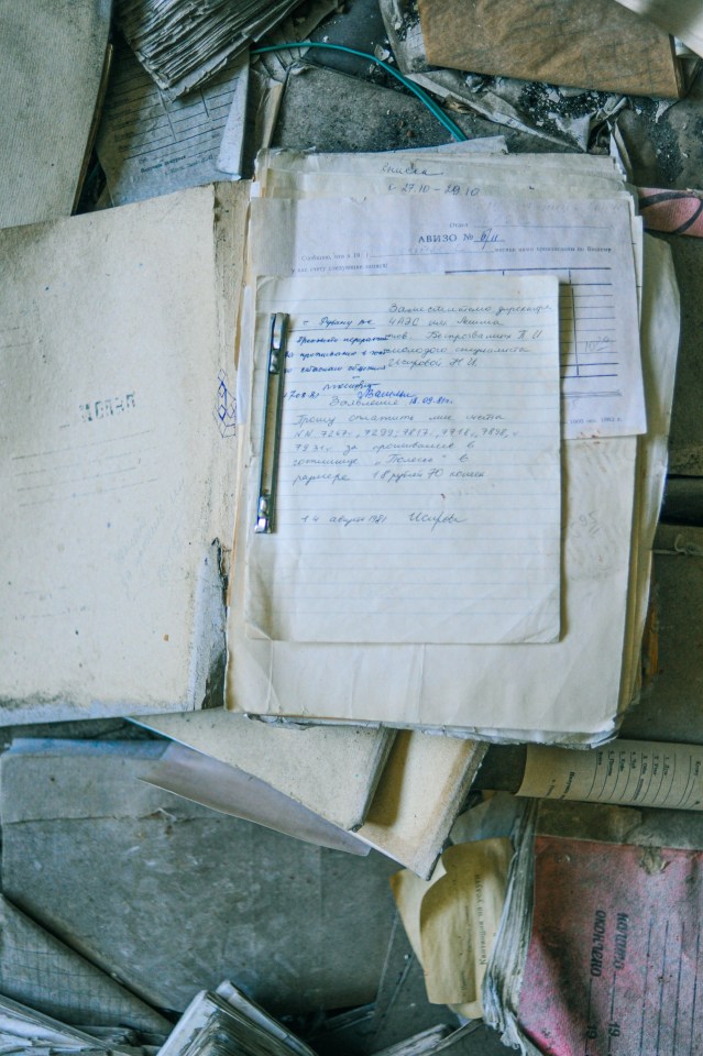  Old schoolbooks litter the floor of a school in Pripyat, Ukraine