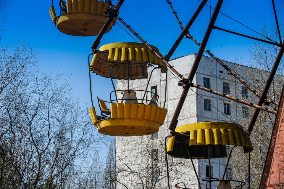  A yellow ferris wheel lies abandoned after the Chernobyl disaster