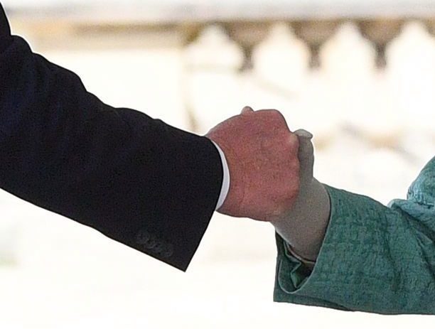  A close up image of the handshake - which looked at first glance like a fist bump